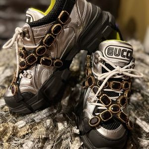 Everyone’s fave Gucci Flashtrek in Silver adorned with purple jewels. Size 39.5
